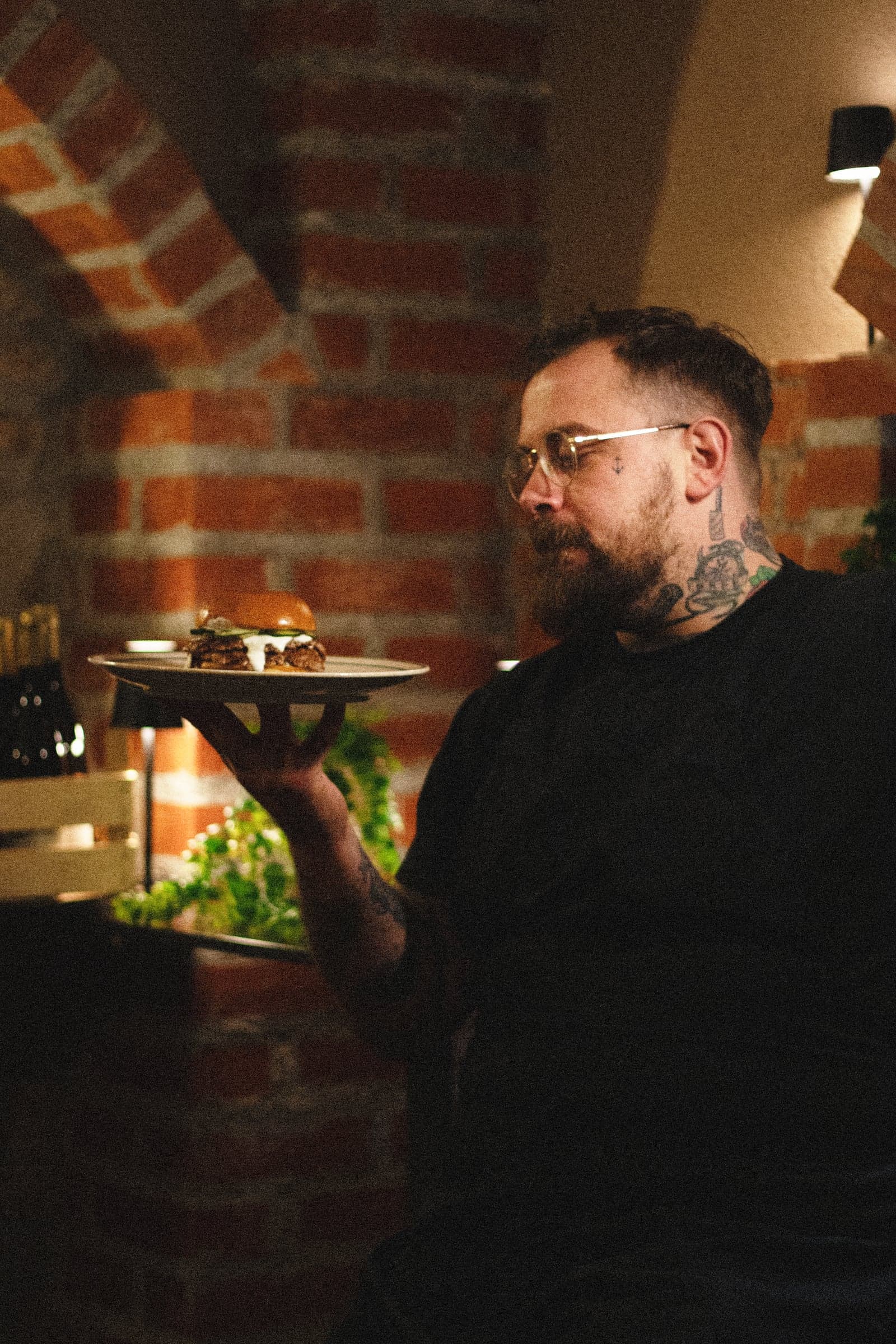 Chef presenting a freshly plated dish