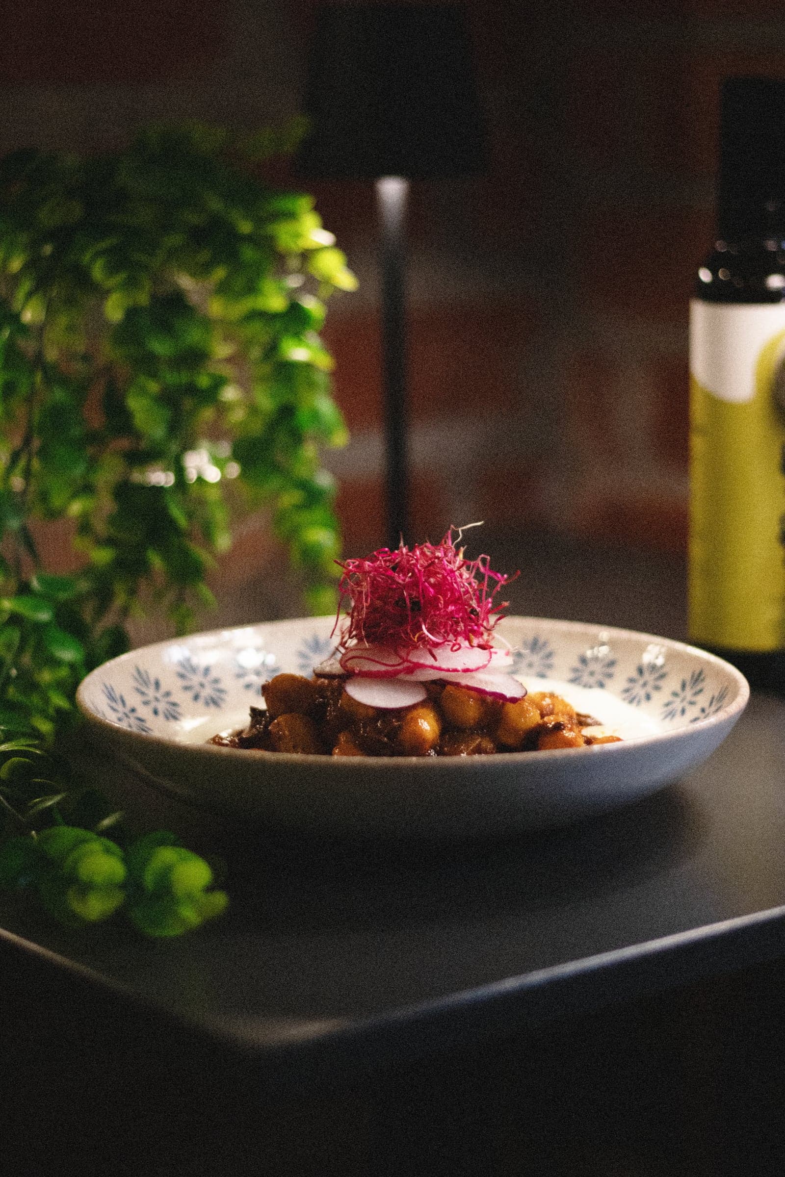 Chickpea bowl with beetroot sprouts and olive oil