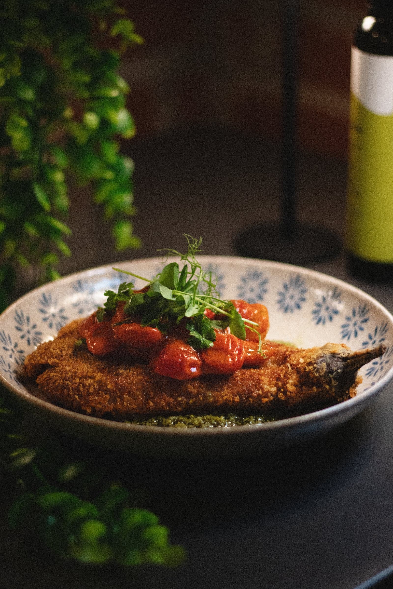 Schnitzel with roasted tomatoes and olive oil